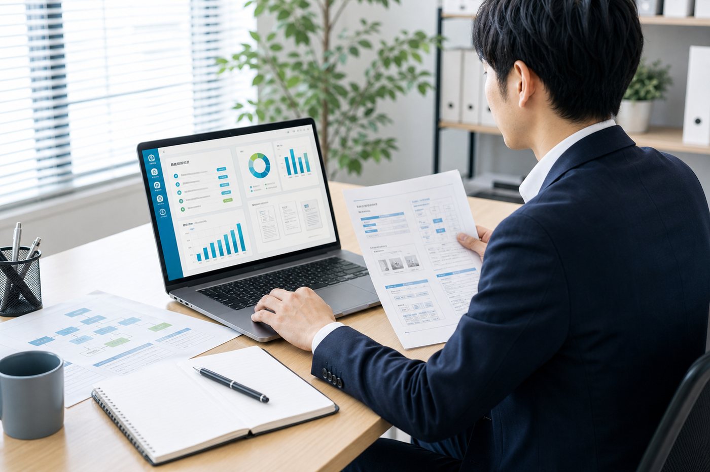 AIによる集計ダッシュボードをノートPCで確認している業務自動化のイメージ
